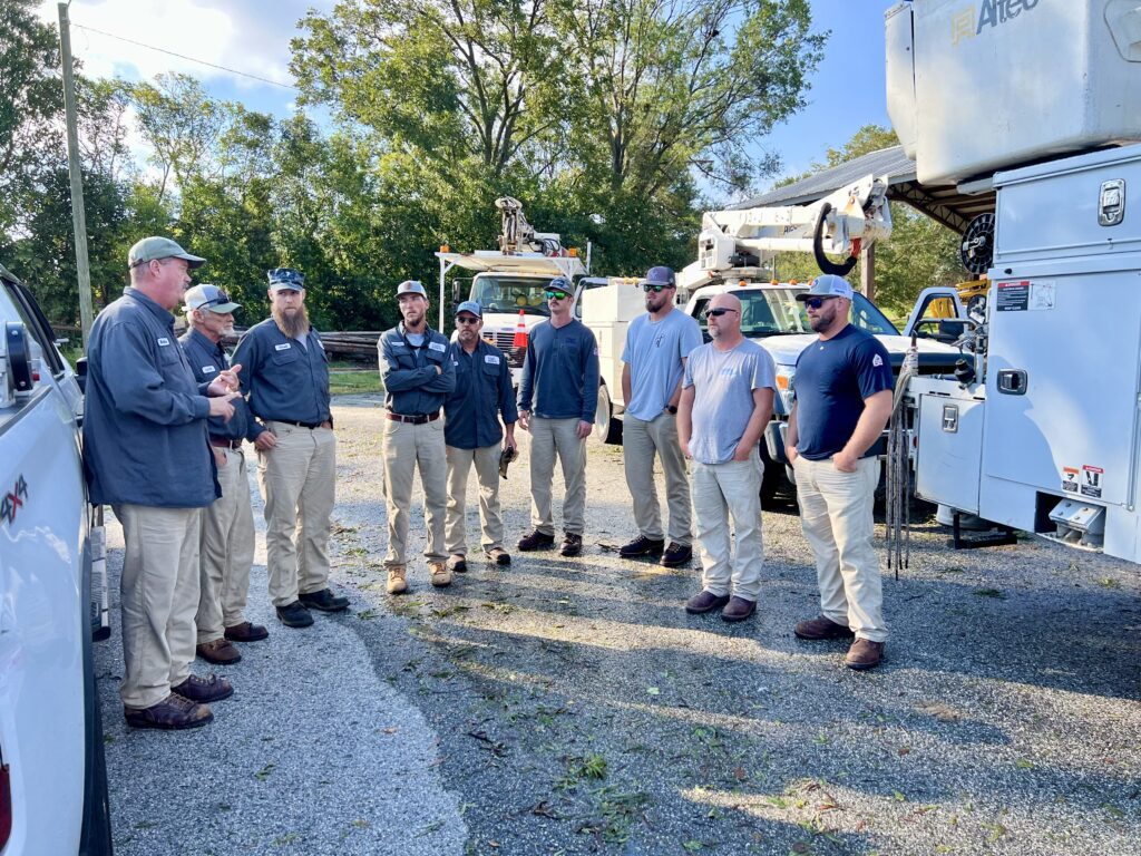 Linemen from Highpoint NC meeting to discuss how to start electrical work in CHerryville NC to restore power after Hurricane Helene.