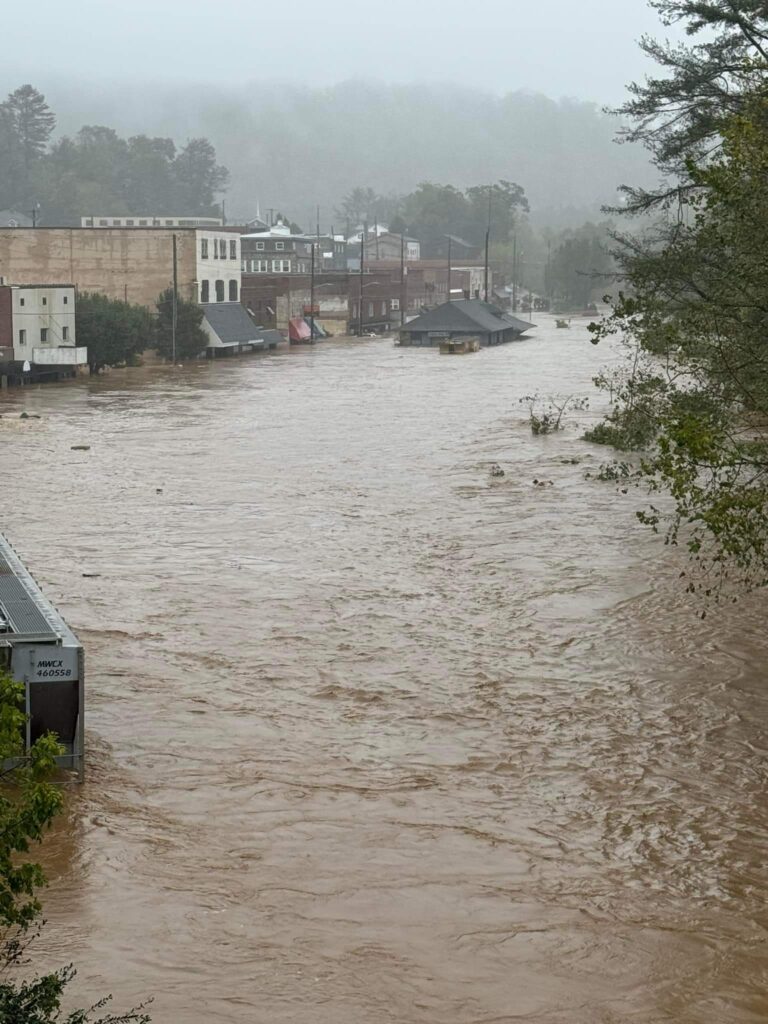 A picture of the North Toe River Flood in Spruce Pine during Hurricane Helene. Locust Street is fully submerged.