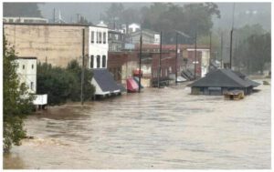 A picture of the North Toe River Flood in Spruce Pine during Hurricane Helene. Locust Street is fully submerged.