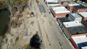 A drone still over Locust Street in Spruce Pine showing the North Toe River, and the efforts made to remove mud from Locust Street after the flooding.