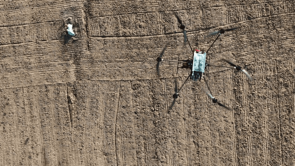 a drone flying over sand