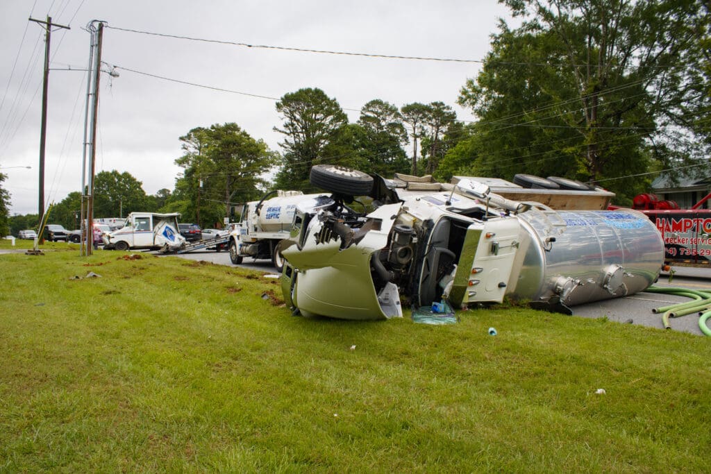 The overturned vacuum tanker on Highway 150 owned by Lake Norman Sewer and Septic LLC.
