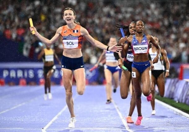 A group of women running on the track.